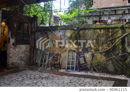 Decayed and mossy walls with an Asian atmosphere Decayed and mossy walls with an Asian atmosphere 90961115