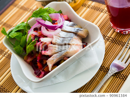 Fresh salad vinaigrette on a bamboo napkin. 90961384