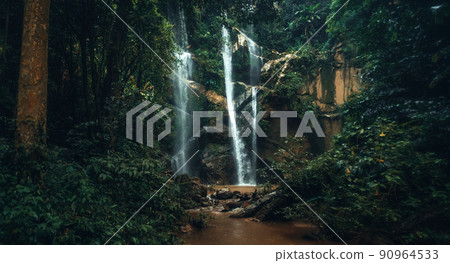 Waterfall in the tropical forest in the rainy season 90964533