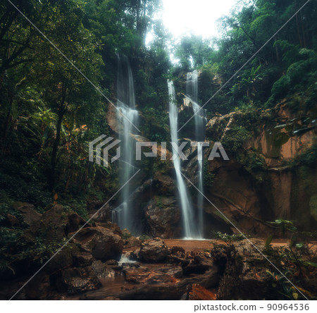 Waterfall in the tropical forest in the rainy season Waterfall in the tropical forest in the rainy season 90964536