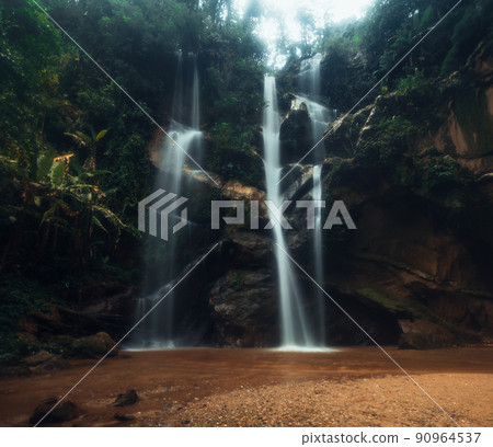 Waterfall in the tropical forest in the rainy season Waterfall in the tropical forest in the rainy season 90964537