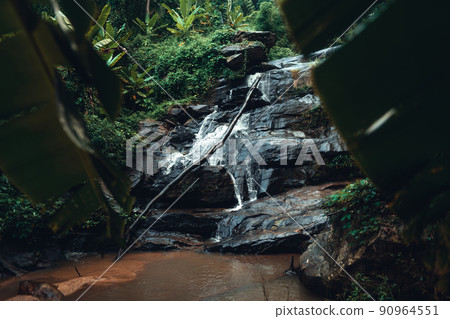 Waterfall in the tropical forest in the rainy season 90964551