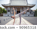 A woman doing yoga at a temple 90965318