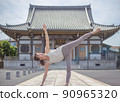 A woman doing yoga at a temple 90965320