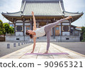 A woman doing yoga at a temple 90965321