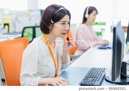 Operator receiving a complaint at a call center Operator receiving a complaint at a call center 90968581