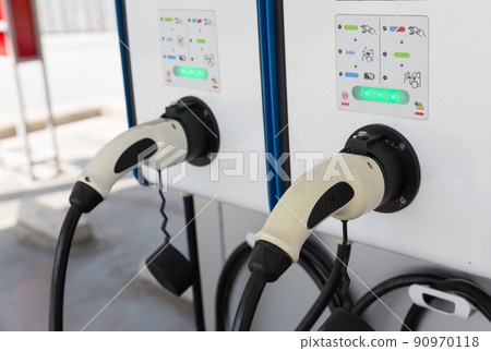 Electric car charging station. Hybrid car Electric charger station in the Car Park. Electric car charging station. Hybrid car Electric charger station in the Car Park. 90970118