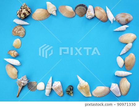 Beautiful seashells are laid out in the form of a frame on a blue background. Vacation on the beach. Flat lay, Place for text Beautiful seashells are laid out in the form of a frame on a blue background. Vacation on the beach. Flat lay, Place for text 90971330