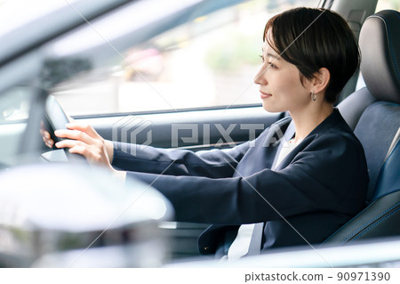 Middle lady driving a car Middle lady driving a car 90971390