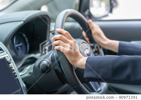 Middle woman driving a car 90971391