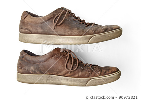 Stylish weathered vintage brown leather shoes isolated on white background Stylish weathered vintage brown leather shoes isolated on white background 90972821