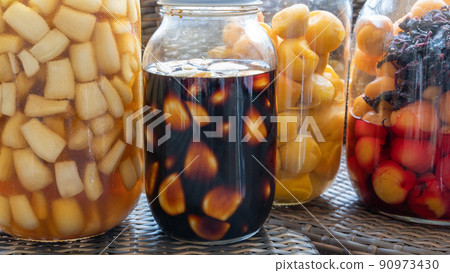 Umeboshi pickled in a fruit liquor bottle, pickled in garlic soy sauce, pickled in sweet and sour sauce (garlic focus) Umeboshi pickled in a fruit liquor bottle, pickled in garlic soy sauce, pickled in sweet and sour sauce (garlic focus) 90973430