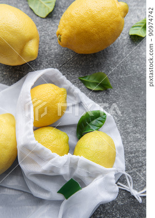 Eco-friendly bag with ripe lemons Eco-friendly bag with ripe lemons 90974742