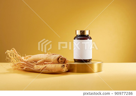A front view of ginseng decorated in wooden dish in yellow background  90977286
