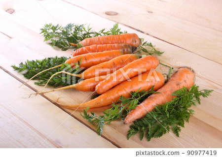 Carrots on table Carrots on table 90977419