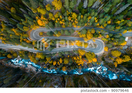 Top view of mountain road in forest with blue river 90979646