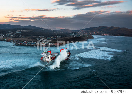 Container ship on stormy sea delivering cargo 90979723
