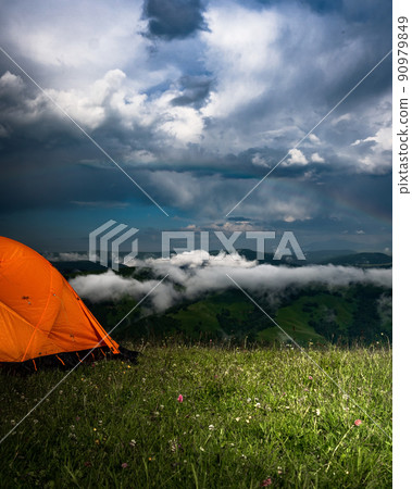 Camping in the mountains with tent standing on a hill, night and sunset landscape Camping in the mountains with tent standing on a hill, night and sunset landscape 90979849