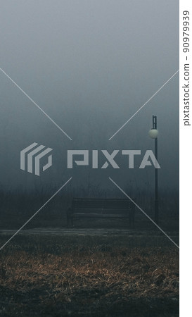 bench in the fog in an abandoned park bench in the fog in an abandoned park 90979939