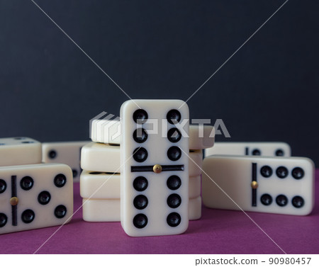 Classic domino chips on a gray background. The concept of free time. Game. 90980457