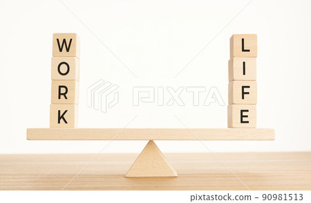 Balance Between Life And Work concept. Wooden blocks with word on Seesaw. Copy space 90981513