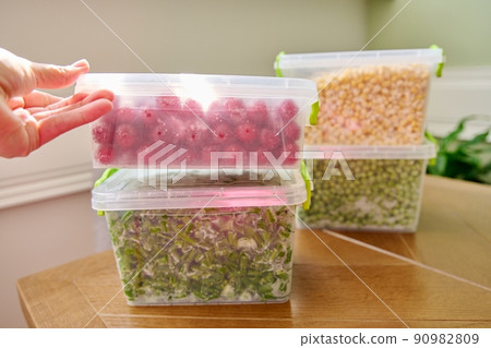 Frozen vegetables and fruits, close-up frozen green onions, peas, cherry, corn 90982809