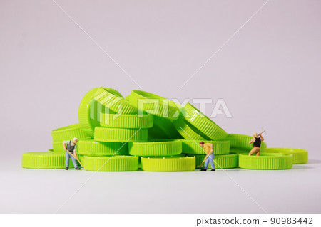 Worker figure standing on plastic cap. Recycle material concept. 90983442