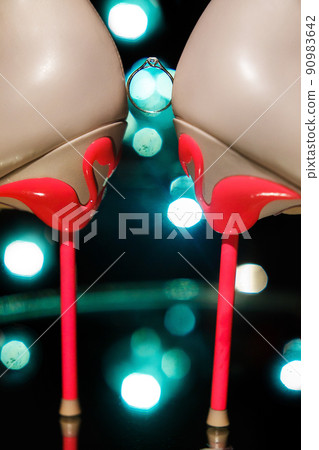 Wedding ring between wedding shoes and highlights Wedding ring between wedding shoes and highlights 90983642