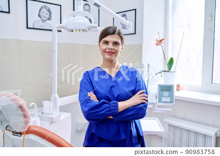 Portrait of confident female dentist doctor in office looking at camera Portrait of confident female dentist doctor in office looking at camera 90983758