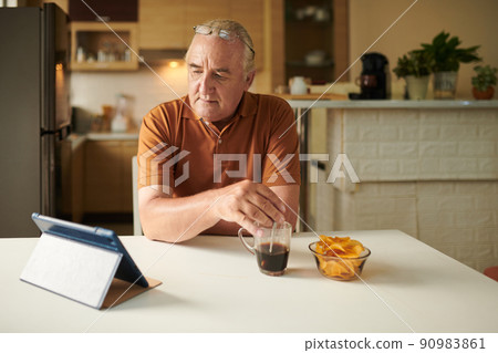 Elderly Man Drinking Morning Coffee 90983861