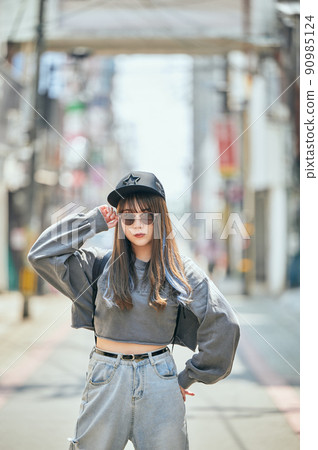 Gen Z women standing looking at the camera 90985124