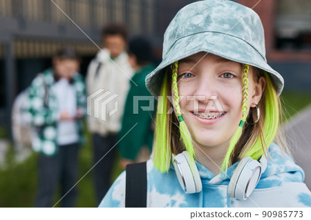Teenage girl with colored hairstyle Teenage girl with colored hairstyle 90985773