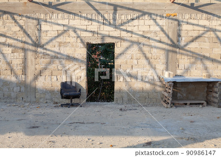 Old weathered brick wall grunge retro texture background. Grunge office with old empty chair Old weathered brick wall grunge retro texture background. Grunge office with old empty chair 90986147