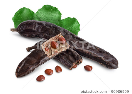 Ripe carob pods and bean isolated on white background with full depth of field 90986909