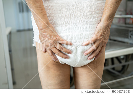 Asian senior or elderly old lady woman patient wearing incontinence diaper in nursing hospital ward, healthy strong medical concept. 90987168