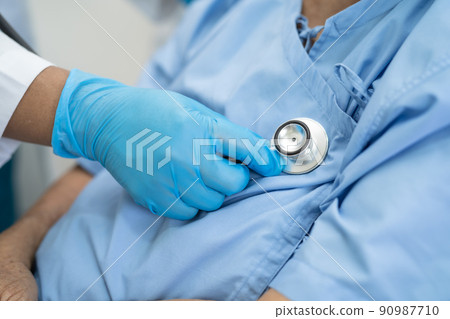Doctor with ppe suit help Asian senior or elderly old lady woman patient in hospital for protect safety infection and kill Covid-19 Coronavirus. Doctor with ppe suit help Asian senior or elderly old lady woman patient in hospital for protect safety infection and kill Covid-19 Coronavirus. 90987710