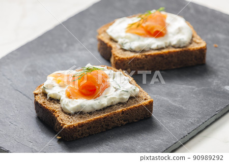 whole grain bread with dill spread and smoked salmon whole grain bread with dill spread and smoked salmon 90989292