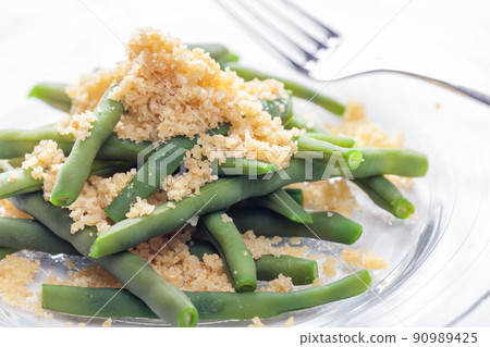 green beans served with bread crumbs 90989425