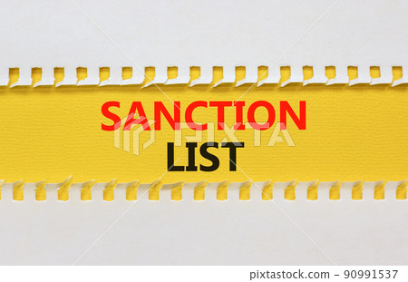 Sanction list symbol. Yellow and white paper with concept words Sanction list on beautiful white background. Business political sanction list concept. Copy space. Sanction list symbol. Yellow and white paper with concept words Sanction list on beautiful white background. Business political sanction list concept. Copy space. 90991537