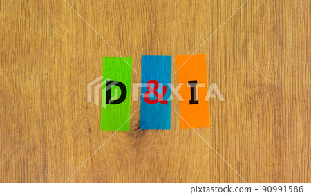 D and I, Diversity and inclusion symbol. Concept words D and I, diversity and inclusion on colored papers on beautiful wooden white background. Business, D and I, diversity and inclusion concept. 90991586