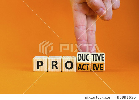 Proactive and productive symbol. Businessman turns cubes and changes the concept word Productive to Proactive. Beautiful orange background. Business, proactive and productive concept. Copy space. Proactive and productive symbol. Businessman turns cubes and changes the concept word Productive to Proactive. Beautiful orange background. Business, proactive and productive concept. Copy space. 90991659