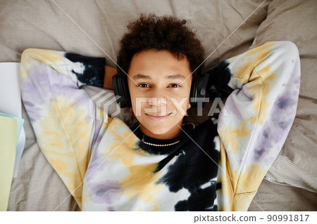 Teen Boy Lying on Bed Teen Boy Lying on Bed 90991817