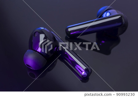 Wireless headphones on black background Wireless headphones on black background 90993230