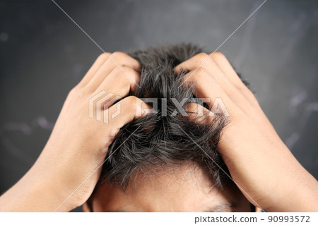 teenage boy Scratching Head Against black background . teenage boy Scratching Head Against black background . 90993572