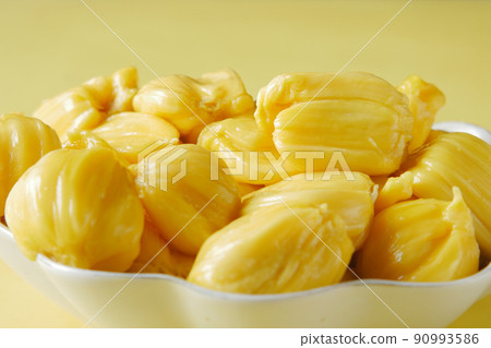 top view of slice of jackfruits in a bowl on table. top view of slice of jackfruits in a bowl on table. 90993586