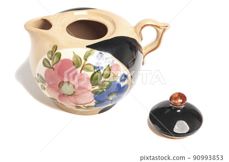 Teapot with pattern isolated in white background. Teapot with pattern isolated in white background. 90993853
