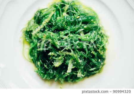 Seaweed Salad in white plate 90994320