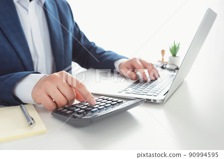 Businessman working in the office. Finance manager Businessman working in the office. Finance manager 90994595