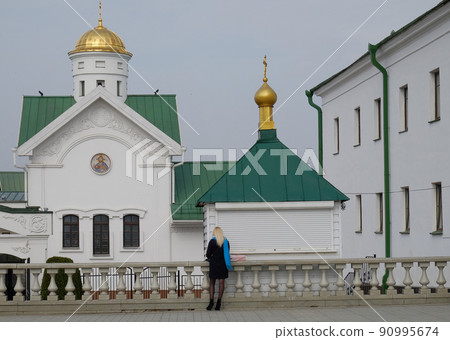 A girl at the building of the Minsk theological Academy. 90995674