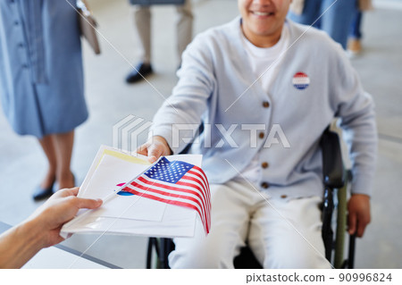 Woman with Disability Voting Close Up 90996824